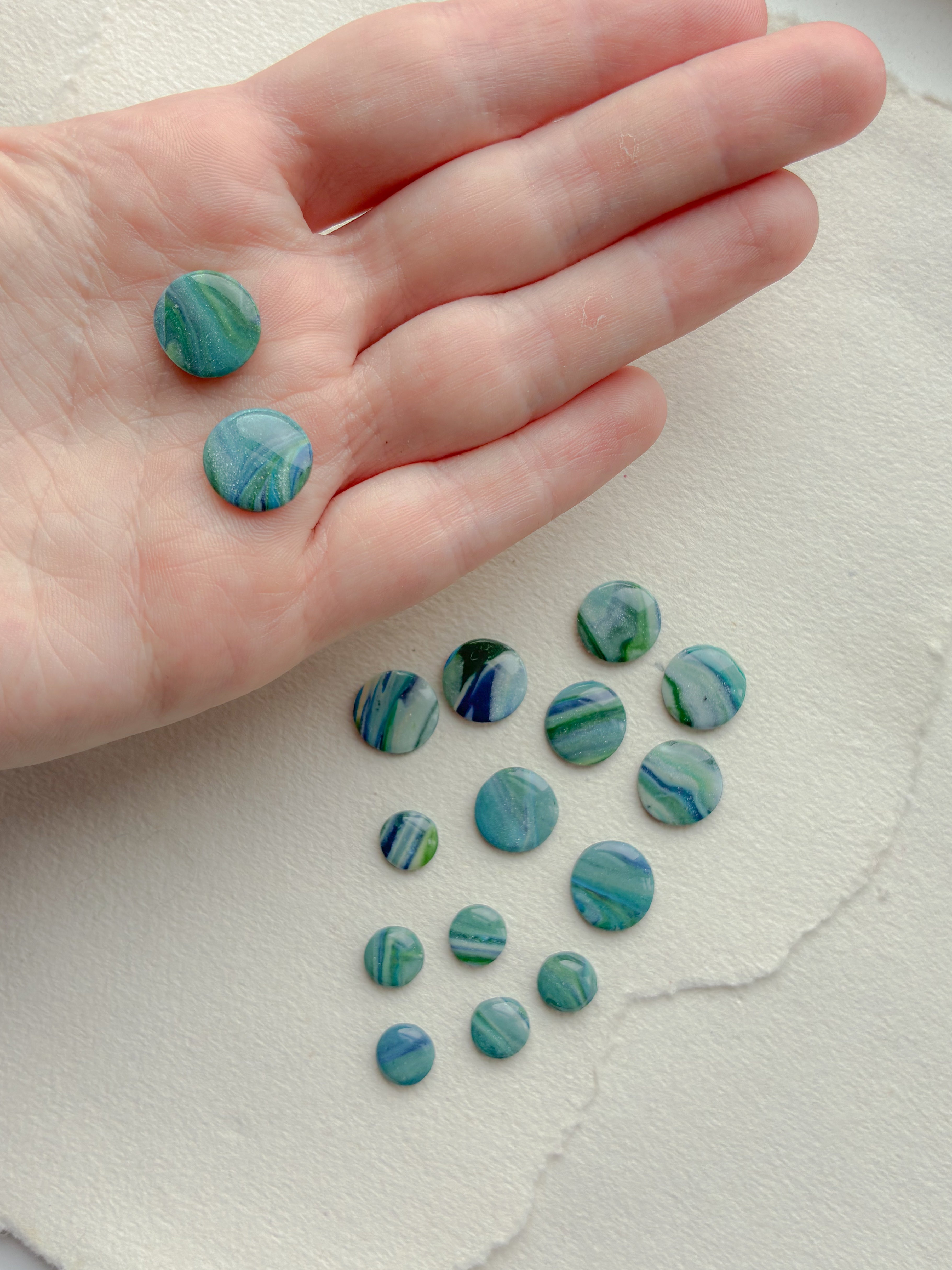 DOTS ørestikker // unika grøn